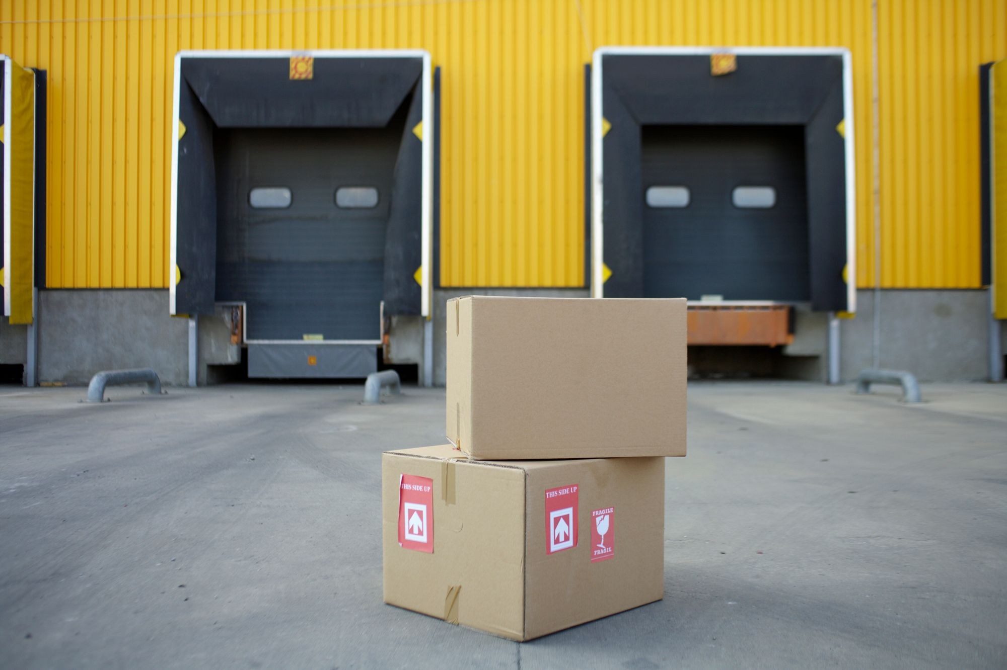 Freight cartons in front of warehouse loading doors